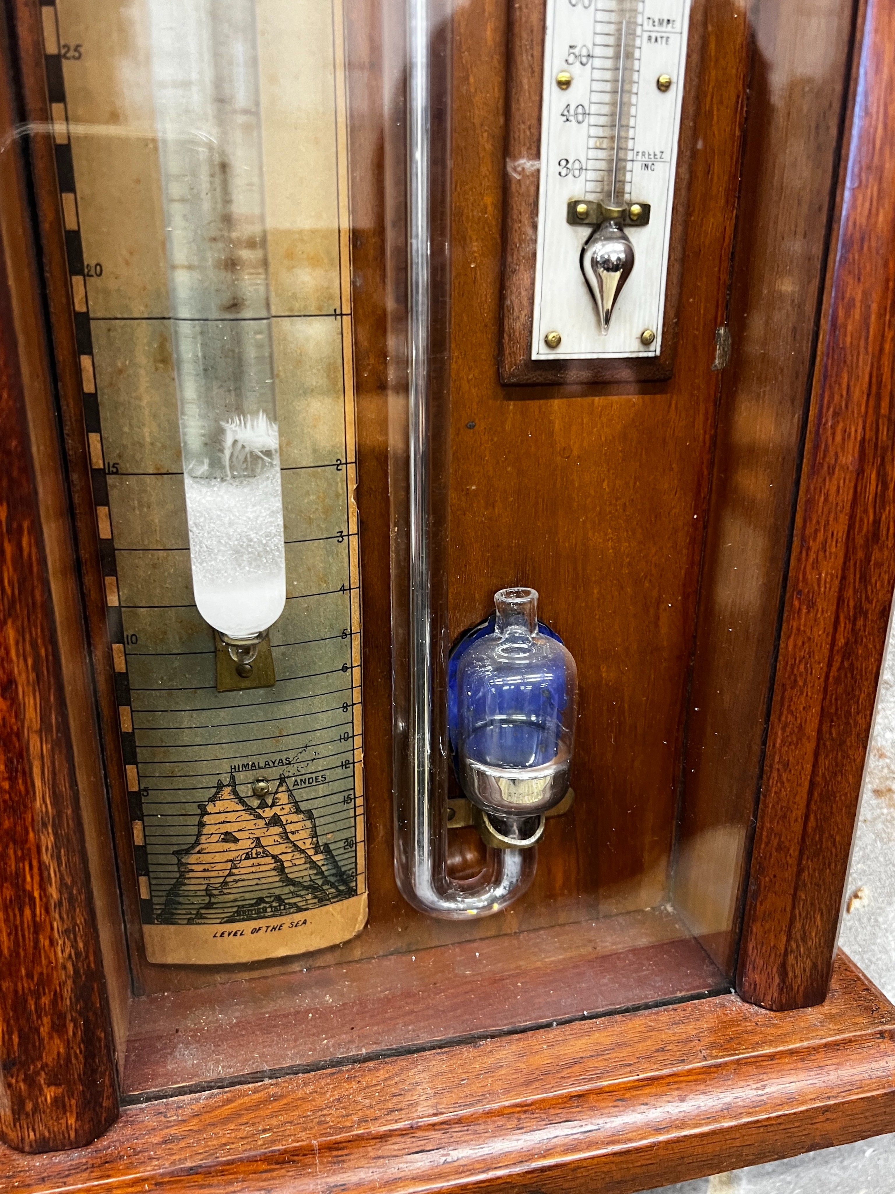 A Victorian oak Admiral Fitzroy type barometer by Thomas Woolley, Chester, height 116cm